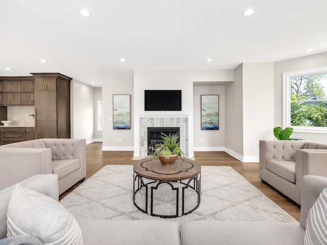 608 W 55th St, Hinsdale, IL 60521 - living room featuring recessed lighting, baseboards, wood finished floors, and a fireplace