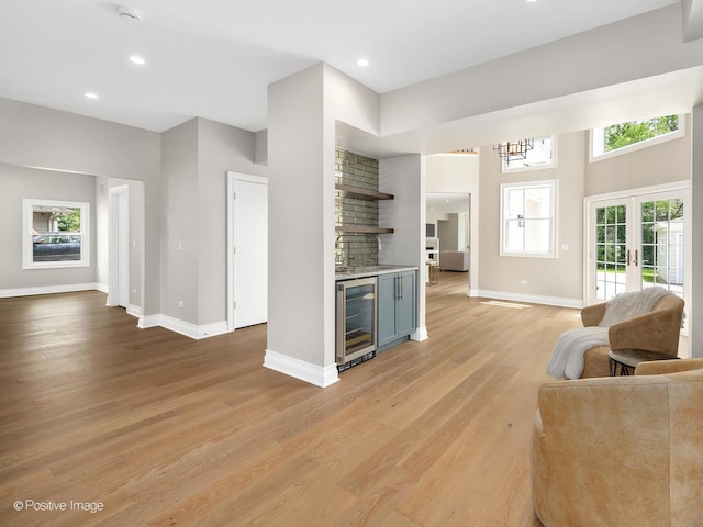 608 W 55th St, Hinsdale, IL 60521 - living room featuring wine cooler, baseboards, light wood finished floors, and recessed lighting