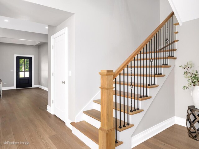 608 W 55th St, Hinsdale, IL 60521 - stairs with wood finished floors, baseboards, and recessed lighting