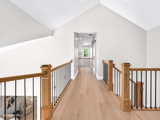 608 W 55th St, Hinsdale, IL 60521 - hall featuring light wood finished floors, an upstairs landing, baseboards, and high vaulted ceiling