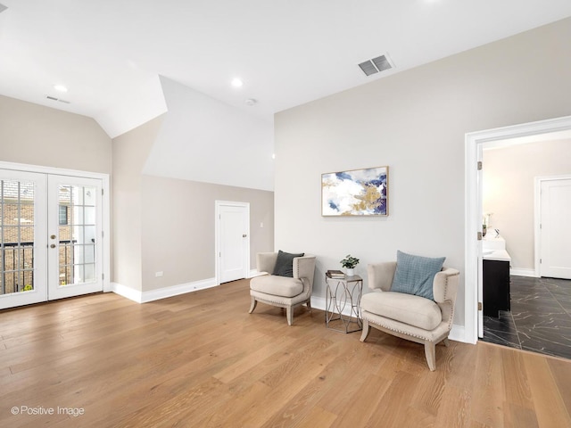 608 W 55th St, Hinsdale, IL 60521 - living area featuring french doors, baseboards, vaulted ceiling, wood finished floors, and recessed lighting