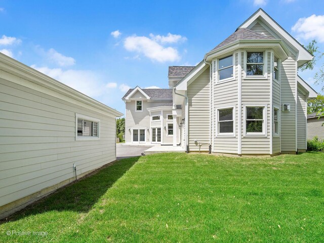 608 W 55th St, Hinsdale, IL 60521 - back of property with a lawn and a patio