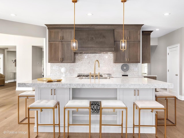 608 W 55th St, Hinsdale, IL 60521 - kitchen with decorative backsplash, baseboards, light wood-type flooring, and recessed lighting