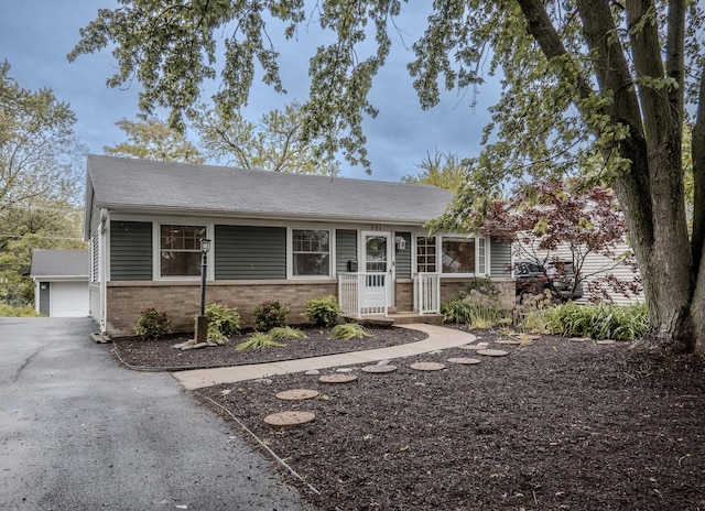 202 S Pierce Ave, Wheaton, IL 60187 - ranch-style house featuring brick siding, an outdoor structure, and a garage