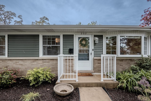 202 S Pierce Ave, Wheaton, IL 60187 - doorway to property featuring brick siding