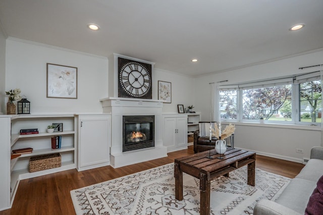 202 S Pierce Ave, Wheaton, IL 60187 - living area with crown molding, wood finished floors, a glass covered fireplace, recessed lighting, and baseboards