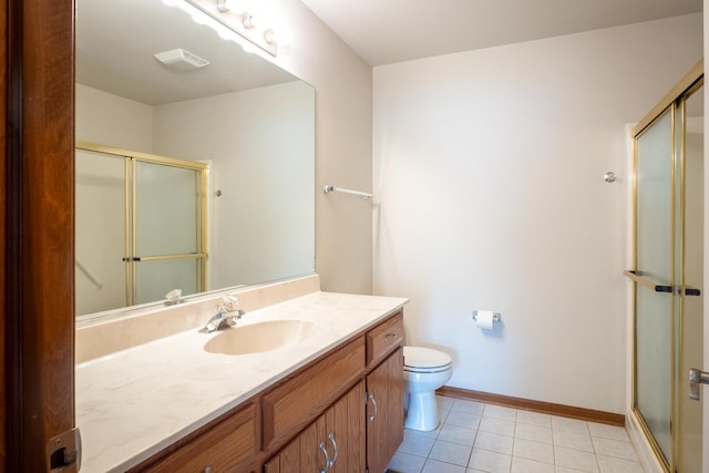 4707 Mikasa Ct, Joliet, IL 60431 - bathroom featuring a stall shower, vanity, toilet, tile patterned floors, and baseboards