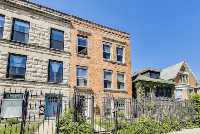 3314 W Carroll Ave, Chicago, IL 60624 - multi unit property with a fenced front yard and a gate