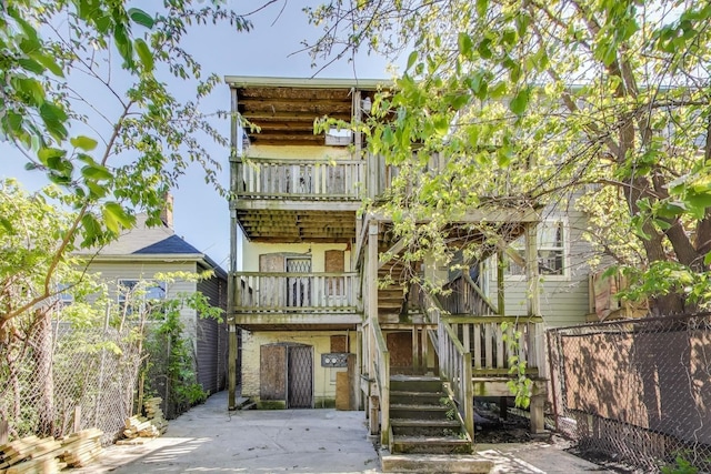3314 W Carroll Ave, Chicago, IL 60624 - rear view of house with a balcony and stairs