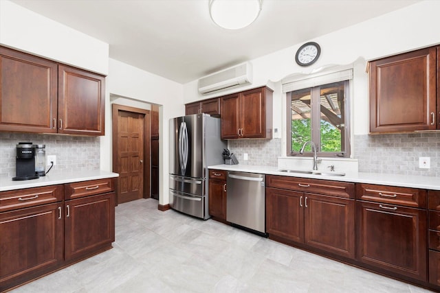 236 Country Club Rd, Chicago Heights, IL 60411 - kitchen with appliances with stainless steel finishes, a sink, an AC wall unit, light countertops, and decorative backsplash