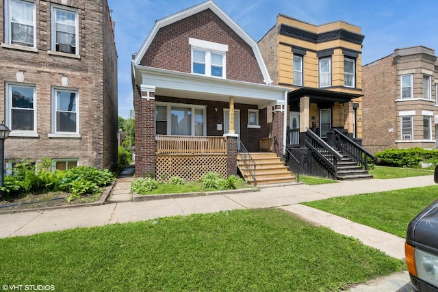 7226 S Rhodes Ave, Chicago, IL 60619 - view of front of home featuring a porch, a front lawn, and brick siding