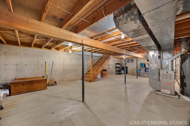 333 Monroe St, Oswego, IL 60543 - unfinished below grade area featuring stairway and heating unit