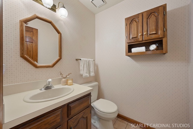 333 Monroe St, Oswego, IL 60543 - bathroom featuring toilet, vanity, tile patterned floors, and wallpapered walls