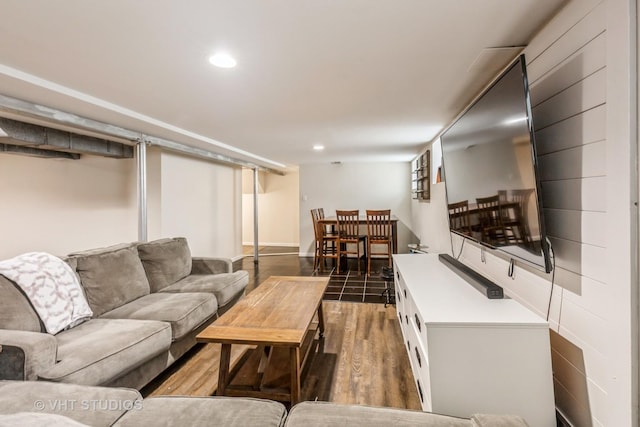 living area with wood finished floors and recessed lighting