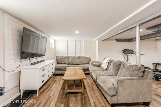 living area with wood finished floors and recessed lighting