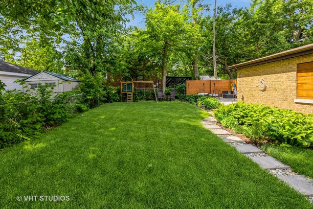 view of yard with a playground and a patio area