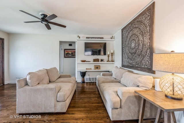 living area with wood finished floors and ceiling fan