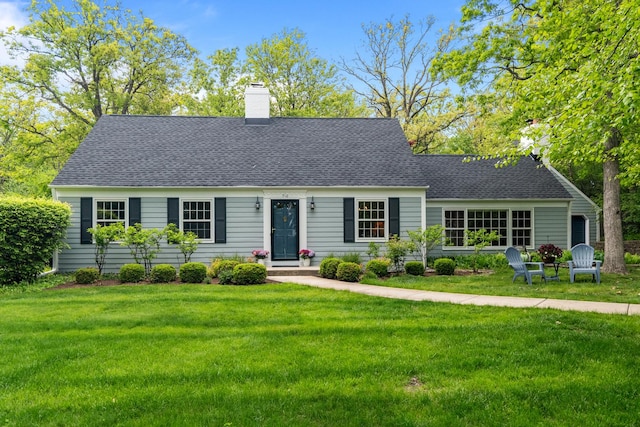 710 Longwood Dr, Lake Forest, IL 60045 - new england style home with a chimney, a front yard, and a shingled roof