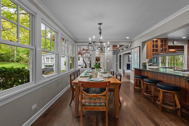 710 Longwood Dr, Lake Forest, IL 60045 - dining room featuring baseboards, plenty of natural light, a chandelier, dark wood-style floors, and crown molding