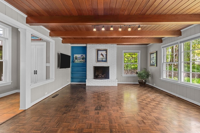 710 Longwood Dr, Lake Forest, IL 60045 - unfurnished living room featuring baseboards, a brick fireplace, wood ceiling with exposed beams, and wooden walls