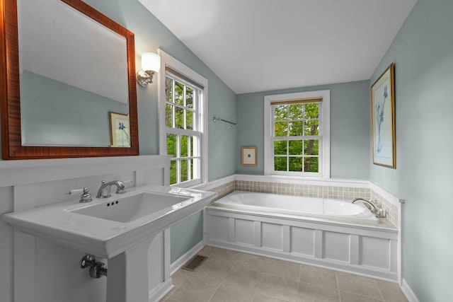 710 Longwood Dr, Lake Forest, IL 60045 - bathroom featuring plenty of natural light, a bath, vaulted ceiling, and tile patterned flooring