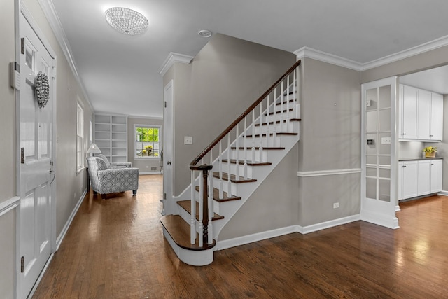 710 Longwood Dr, Lake Forest, IL 60045 - staircase featuring wood finished floors, crown molding, baseboards, and built in features