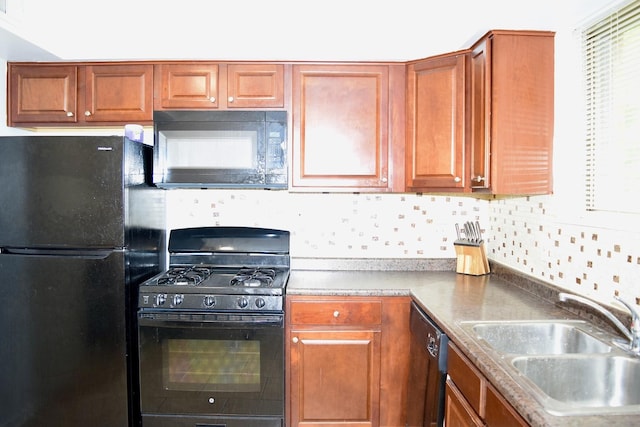 10241 Central Ave Unit 1B, Oak Lawn, IL 60453 - kitchen with black appliances, a sink, tasteful backsplash, and brown cabinets