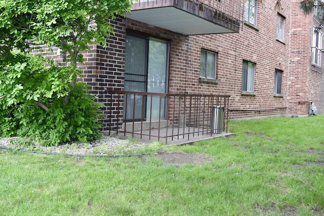 10241 Central Ave Unit 1B, Oak Lawn, IL 60453 - view of side of home featuring brick siding and a yard