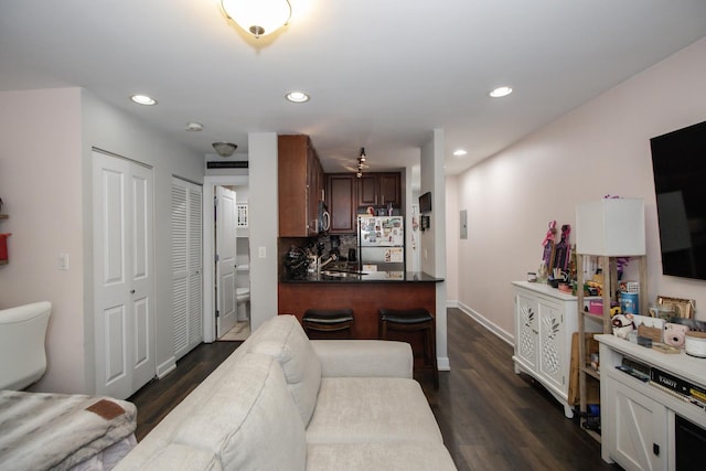 3900 N Pine Grove Ave Unit 203, Chicago, IL 60613 - living area with dark wood-style flooring, recessed lighting, and baseboards