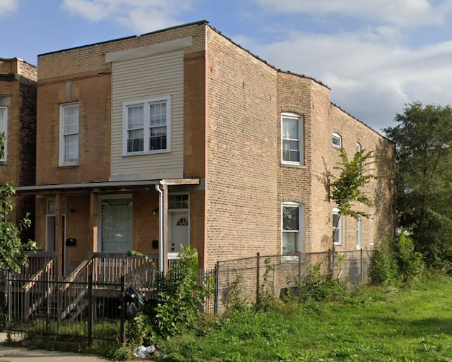4129 W Jackson Blvd, Chicago, IL 60624 - view of property with brick siding and covered porch