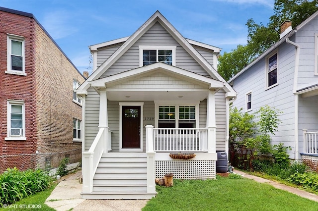 1739 Dodge Ave, Evanston, IL 60201 - view of front of property featuring covered porch and a front lawn