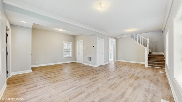 1739 Dodge Ave, Evanston, IL 60201 - unfurnished living room featuring stairs, baseboards, light wood finished floors, and ornamental molding