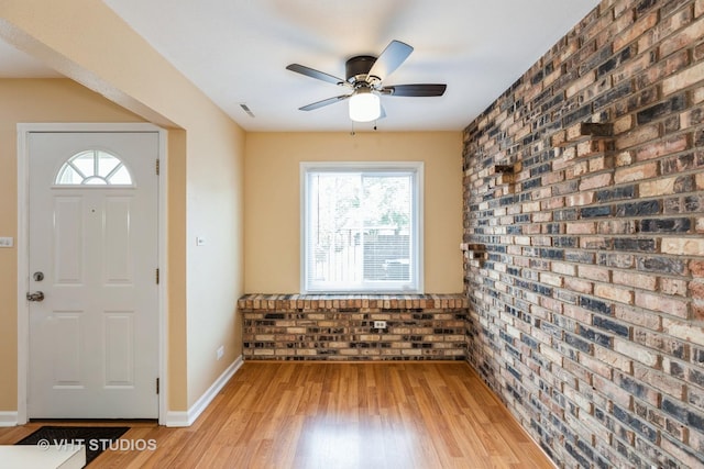 4037 Trafalgar Ln, Oak Lawn, IL 60453 - entrance foyer featuring brick wall, light wood-type flooring, a ceiling fan, and baseboards