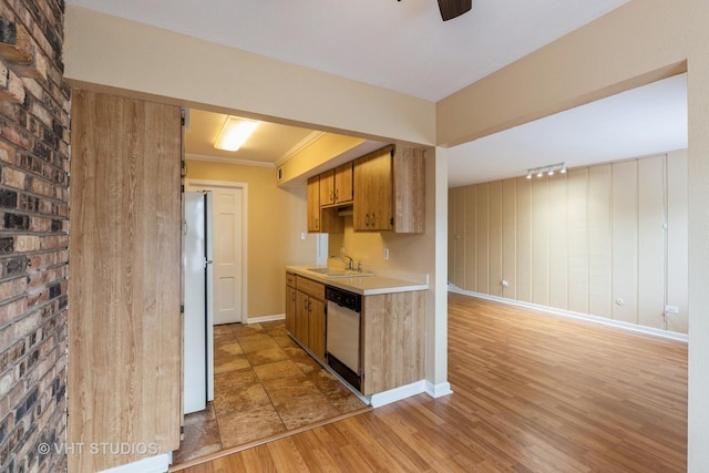 4037 Trafalgar Ln, Oak Lawn, IL 60453 - kitchen featuring dishwashing machine, light countertops, a sink, freestanding refrigerator, and light wood-style floors