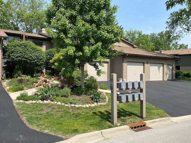 2S414 Emerald Green Dr Unit G, Warrenville, IL 60555 - view of property hidden behind natural elements with asphalt driveway and an attached garage