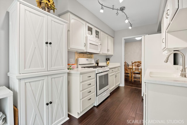 2S414 Emerald Green Dr Unit G, Warrenville, IL 60555 - kitchen featuring white appliances, a sink, dark wood-type flooring, and white cabinets