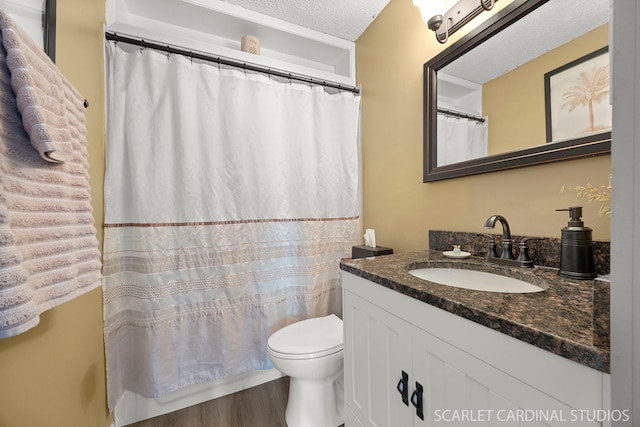 376 Belden Ave, Glendale Heights, IL 60139 - bathroom featuring a textured ceiling, vanity, toilet, wood finished floors, and a shower with shower curtain
