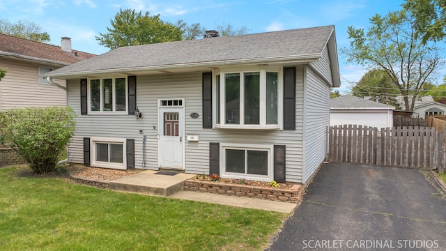 376 Belden Ave, Glendale Heights, IL 60139 - bi-level home with a detached garage, a chimney, and roof with shingles