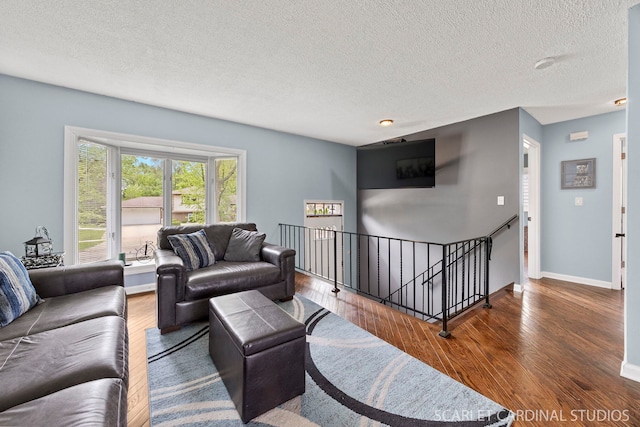 376 Belden Ave, Glendale Heights, IL 60139 - living area with wood finished floors, a textured ceiling, and baseboards