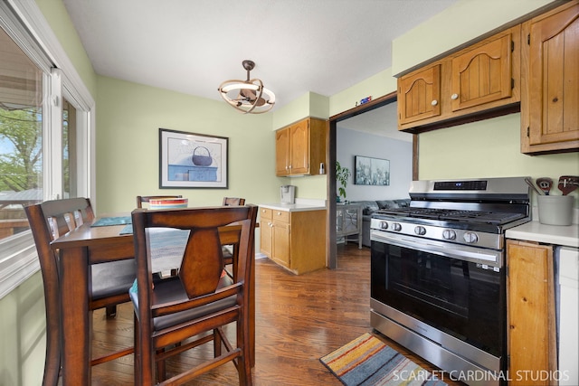 376 Belden Ave, Glendale Heights, IL 60139 - kitchen with stainless steel gas stove, light countertops, dark wood-style floors, and brown cabinetry