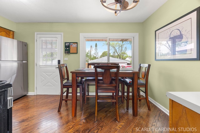 376 Belden Ave, Glendale Heights, IL 60139 - dining area with dark wood-style flooring, baseboards, and a chandelier