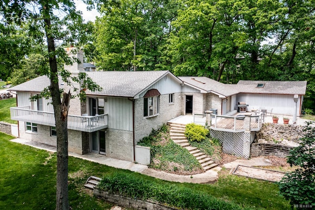 13443 S Forest Ln, Lockport, IL 60441 - view of front of property with a shingled roof, stairway, a wooden deck, a front yard, and view of wooded area