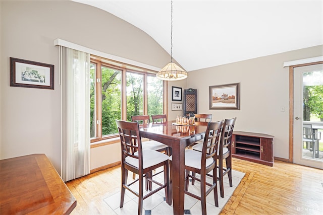 13443 S Forest Ln, Lockport, IL 60441 - dining room featuring light wood-style flooring, lofted ceiling, and baseboards