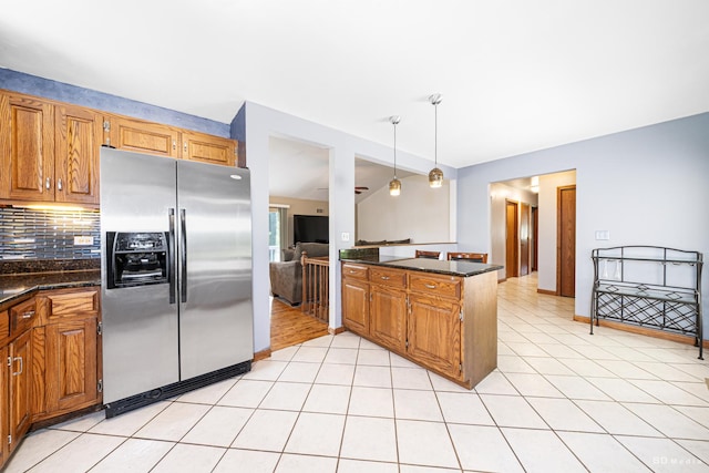 13443 S Forest Ln, Lockport, IL 60441 - kitchen with stainless steel fridge, a peninsula, backsplash, and brown cabinets
