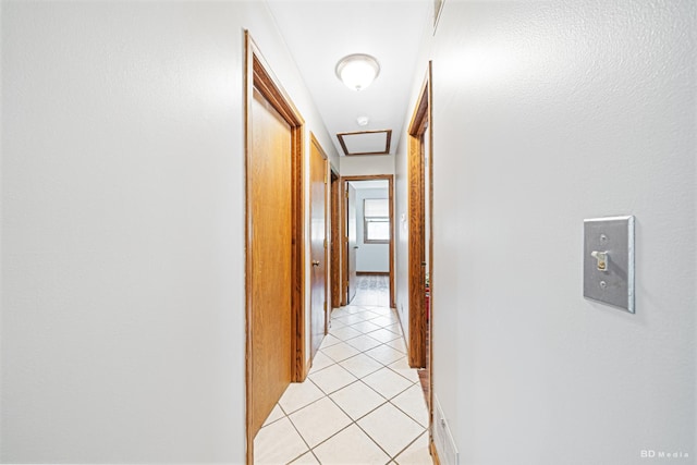 13443 S Forest Ln, Lockport, IL 60441 - hallway featuring light tile patterned floors and attic access