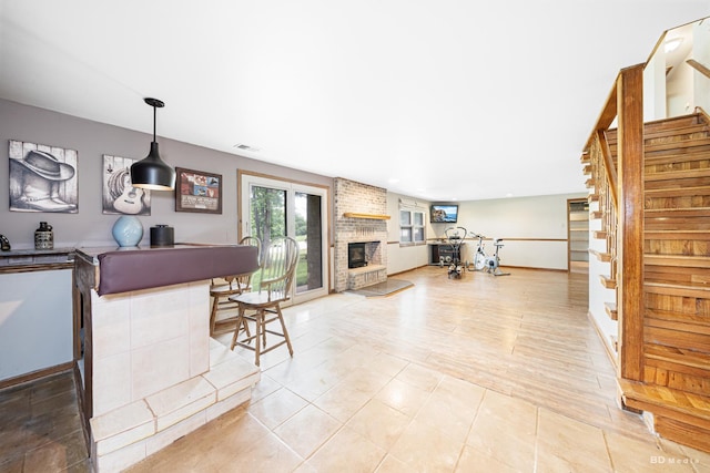 13443 S Forest Ln, Lockport, IL 60441 - kitchen with open floor plan, a fireplace, baseboards, and hanging light fixtures
