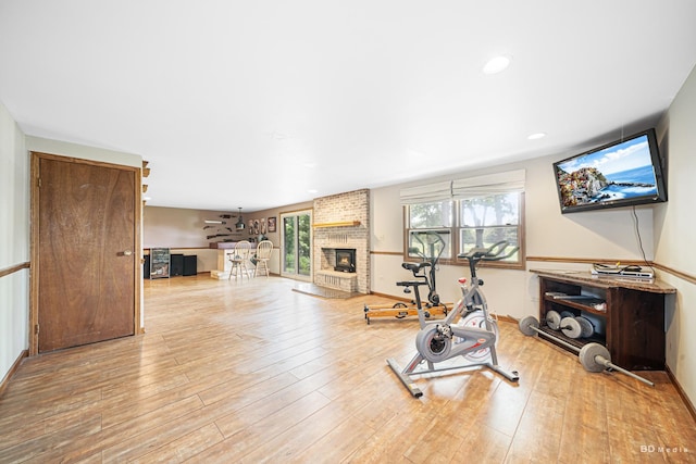 13443 S Forest Ln, Lockport, IL 60441 - workout area featuring a brick fireplace, wood finished floors, baseboards, and recessed lighting