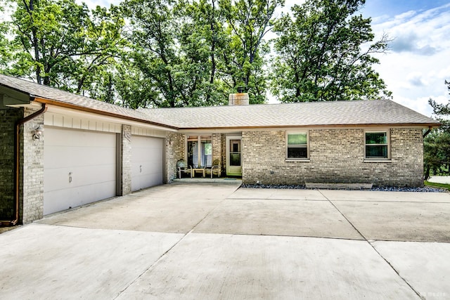 13443 S Forest Ln, Lockport, IL 60441 - ranch-style house with a garage, brick siding, concrete driveway, and a chimney