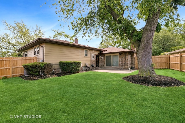 17124 Langley Ave, South Holland, IL 60473 - rear view of house featuring a chimney and a patio area