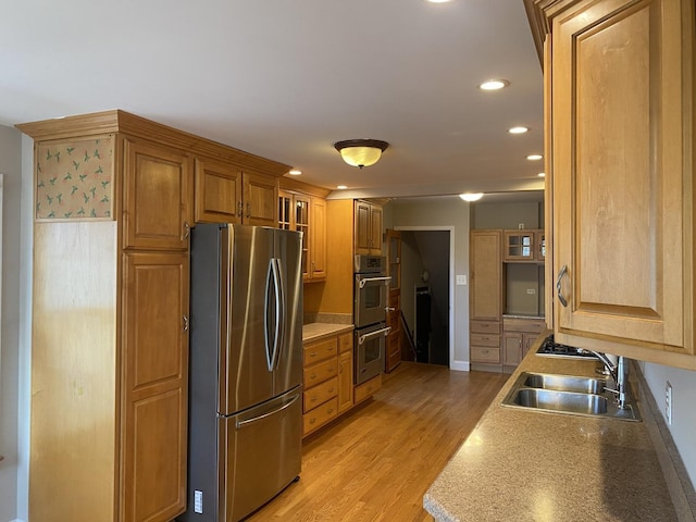 10724 S Ridgeway Ave, Chicago, IL 60655 - kitchen featuring appliances with stainless steel finishes, a sink, light wood-style floors, recessed lighting, and brown cabinetry